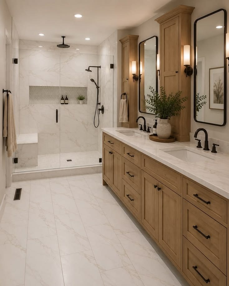 Long wood vanity with black fixtures and walk-in glass shower